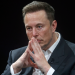 Elon Musk looking pensive with fingers tented